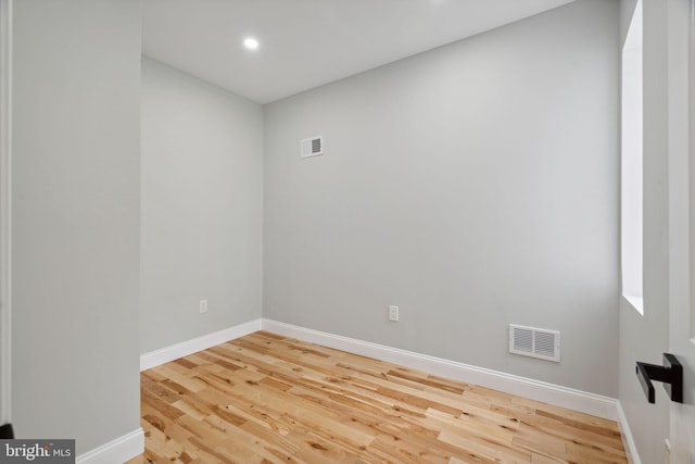 spare room featuring hardwood / wood-style floors