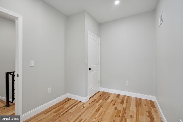 empty room with wood-type flooring