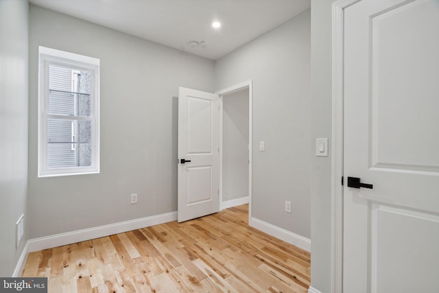 unfurnished room featuring light wood-type flooring