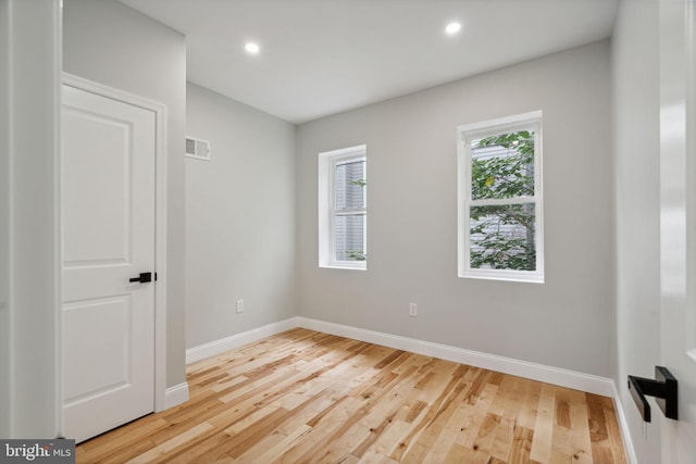 unfurnished room featuring light hardwood / wood-style floors