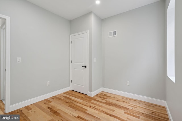 unfurnished room featuring hardwood / wood-style floors