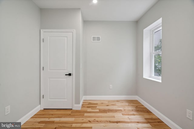 unfurnished room with light hardwood / wood-style floors