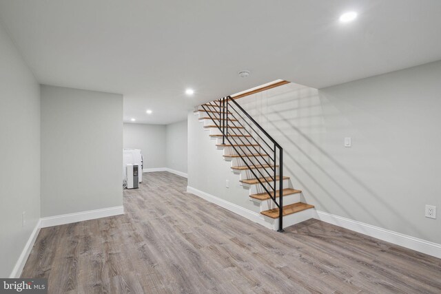 3013 Wharton St, Philadelphia, PA 19146 - finished basement featuring stairway, wood finished floors, recessed lighting, and baseboards