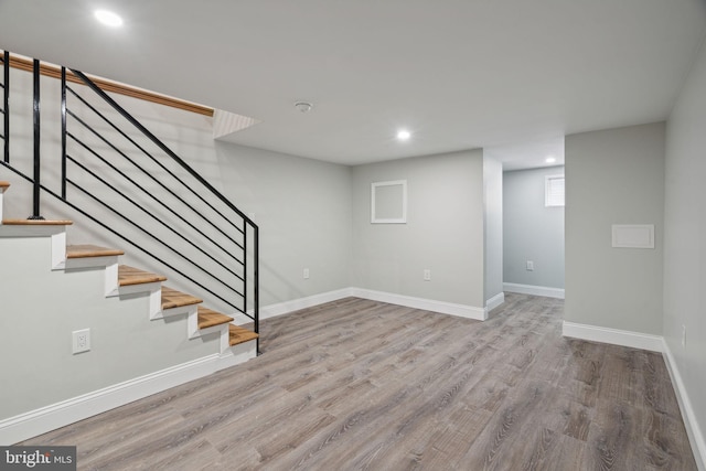 basement featuring light hardwood / wood-style floors