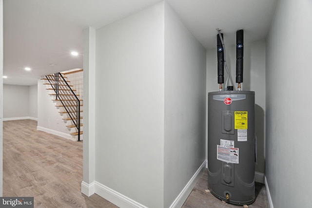 utility room with electric water heater