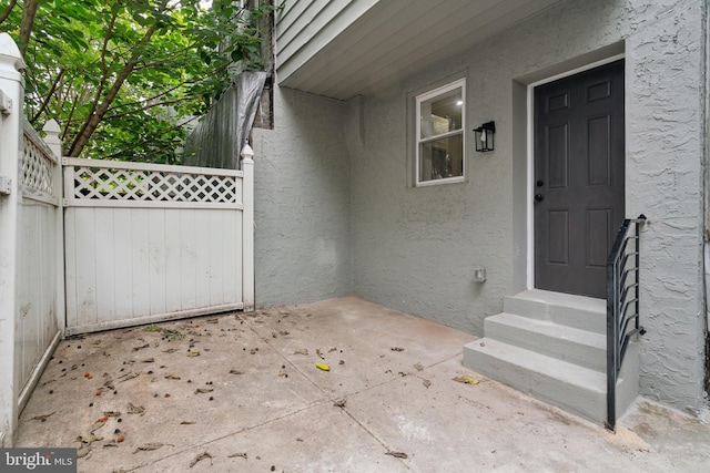 3013 Wharton St, Philadelphia, PA 19146 - doorway to property with stucco siding and a patio