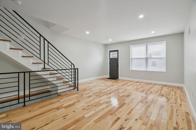 foyer entrance with light hardwood / wood-style flooring