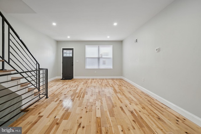 3013 Wharton St, Philadelphia, PA 19146 - foyer entrance featuring wood finished floors, stairs, baseboards, and recessed lighting