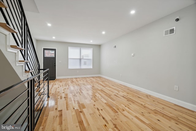 3013 Wharton St, Philadelphia, PA 19146 - unfurnished living room featuring stairs, light wood-type flooring, recessed lighting, and baseboards
