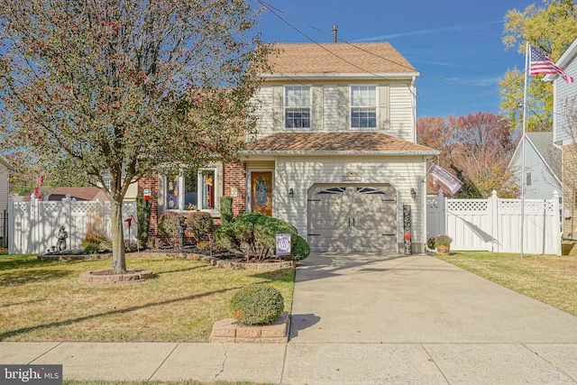 view of front of house with a front lawn and a garage