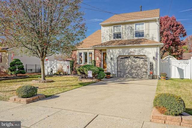 view of front of property with a garage and a front lawn