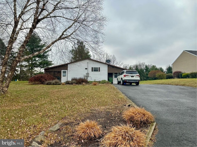 view of home's exterior featuring a yard