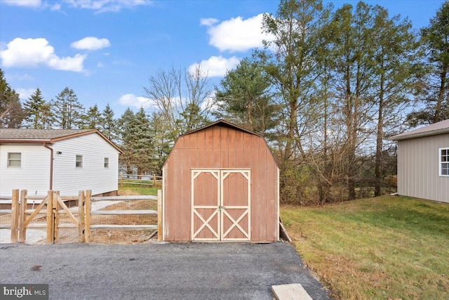 view of outbuilding featuring a yard