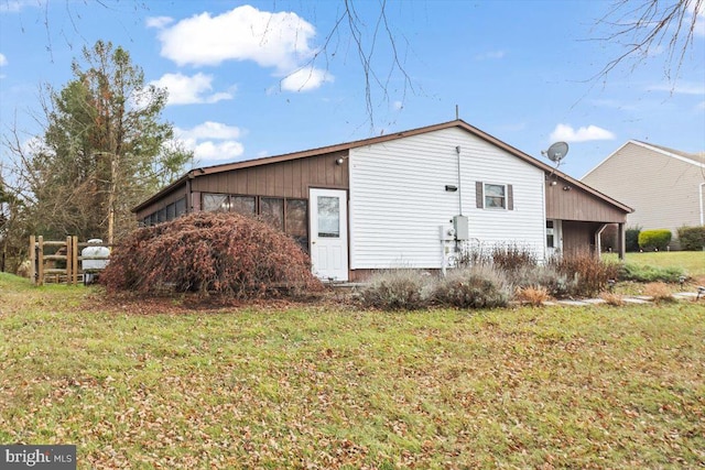 view of home's exterior with a yard