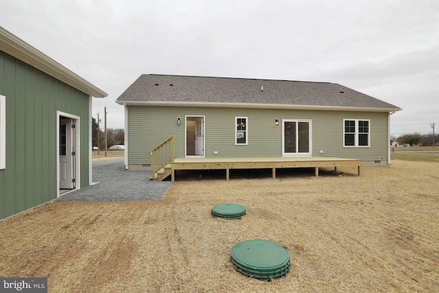 rear view of house with a deck