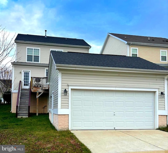 view of front of house featuring a wooden deck and a garage