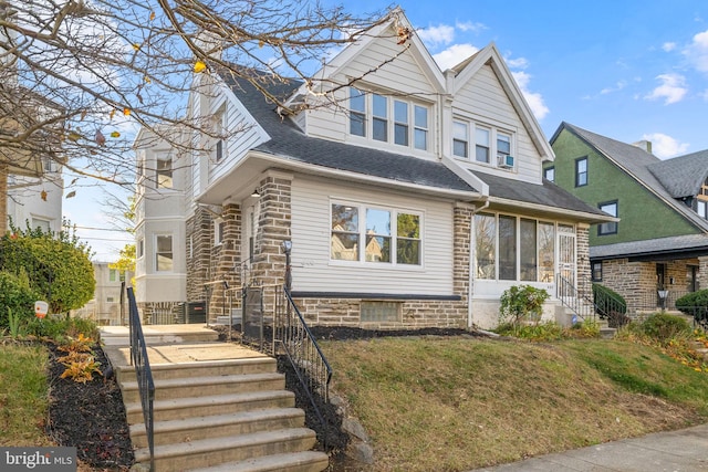 view of front of property with a sunroom