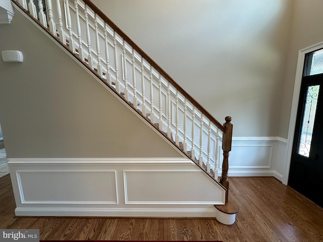 foyer with wood-type flooring