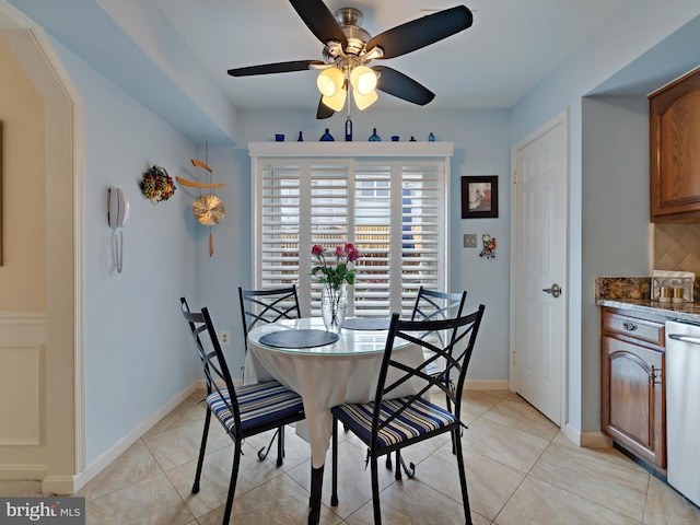 dining space featuring light tile patterned floors and ceiling fan