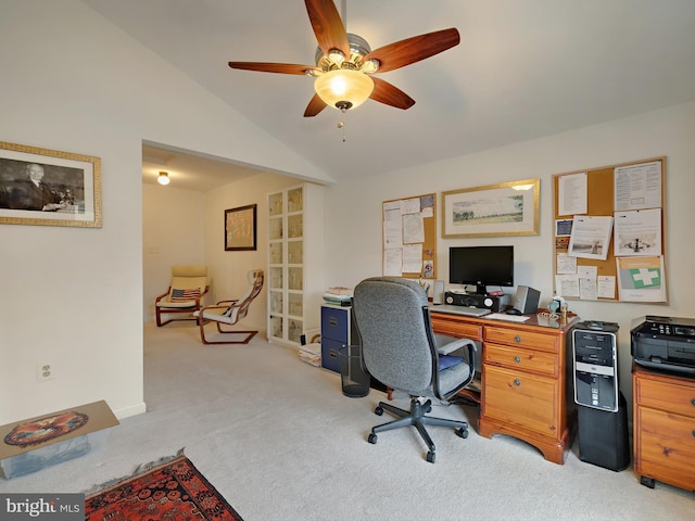 carpeted home office featuring ceiling fan and vaulted ceiling