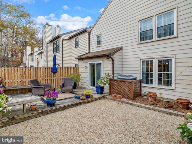 back of property with central AC, a patio area, and a wooden deck