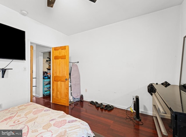 bedroom featuring ceiling fan and dark hardwood / wood-style flooring