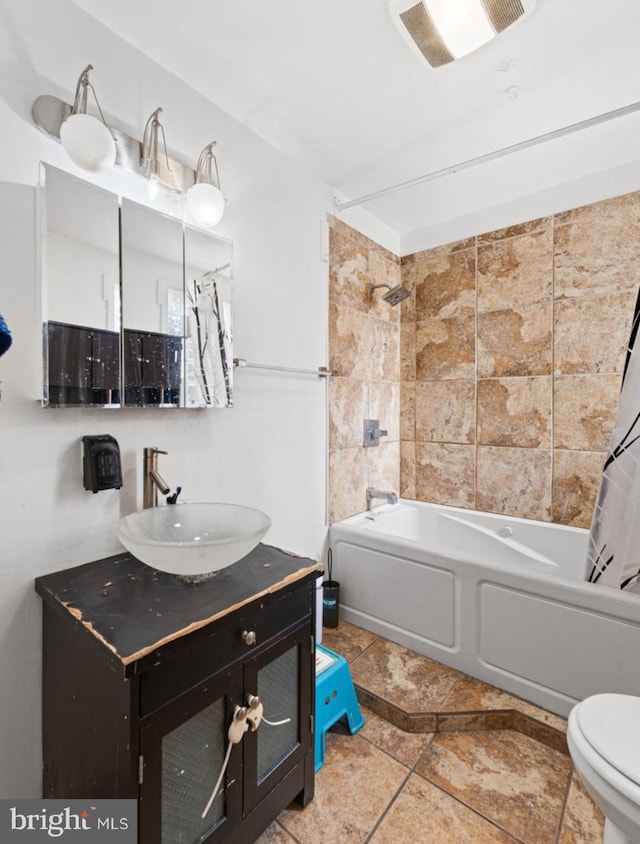 full bathroom with tile patterned flooring, vanity, toilet, and shower / tub combo