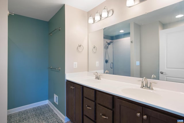 bathroom featuring tile patterned floors, vanity, and an enclosed shower