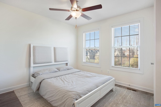 bedroom featuring ceiling fan and wood-type flooring