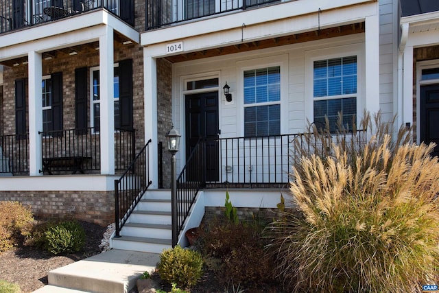 doorway to property featuring a porch