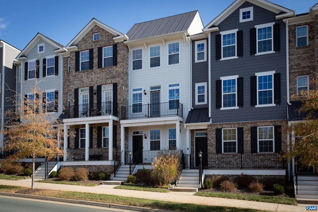 multi unit property featuring a porch