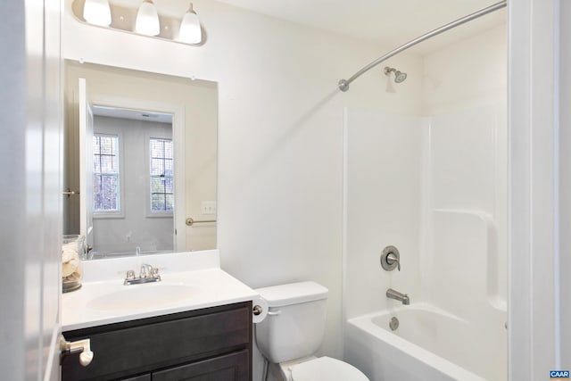 full bathroom featuring vanity, shower / bath combination, and toilet