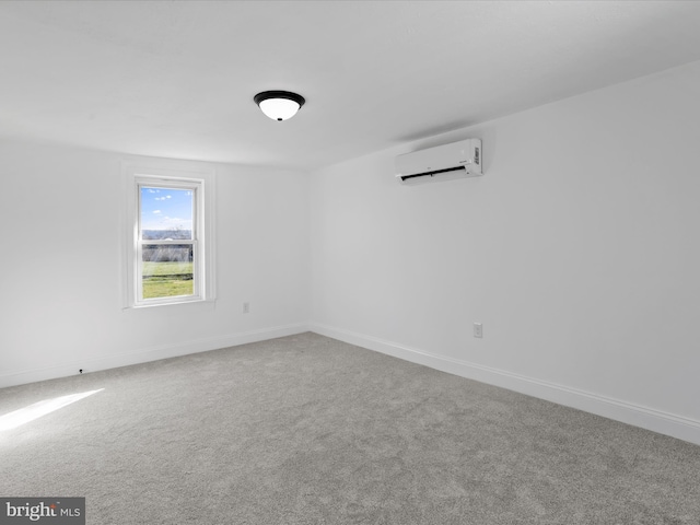 unfurnished room with an AC wall unit and carpet