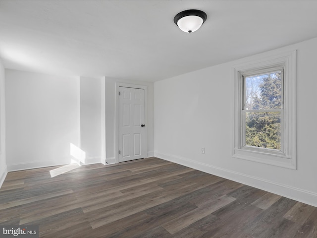 empty room featuring dark hardwood / wood-style floors