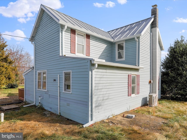 view of side of home featuring central air condition unit