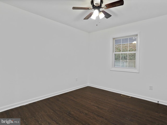 spare room featuring hardwood / wood-style flooring and ceiling fan