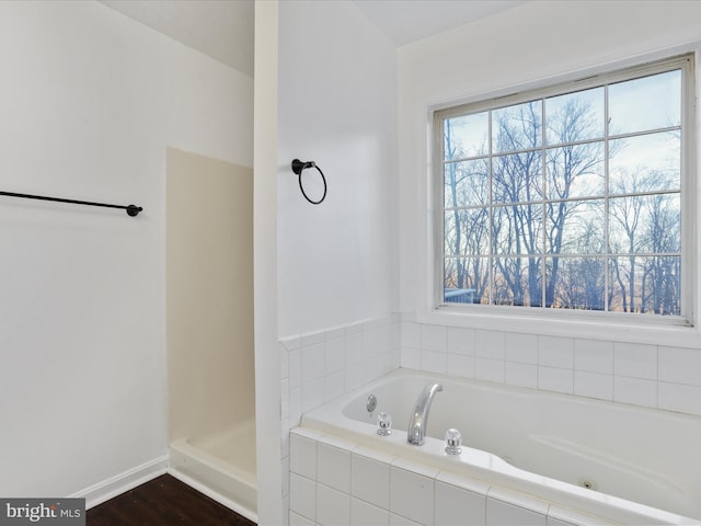 689 Windy Way, Front Royal, VA 22630 - bathroom featuring a bath, baseboards, and wood finished floors