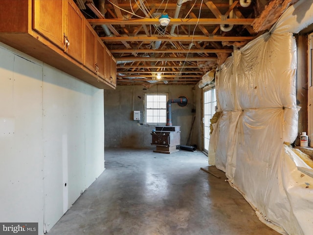 basement featuring a wood stove