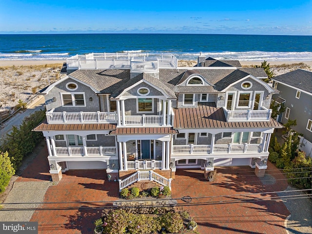 bird's eye view with a water view and a view of the beach