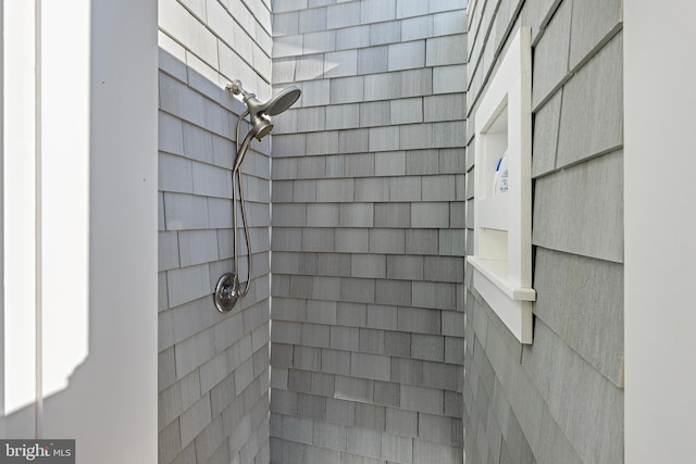 details featuring a tile shower