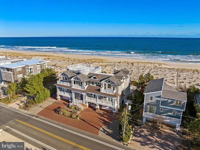 drone / aerial view with a view of the beach and a water view