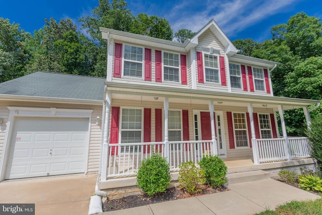 view of front of house with a garage and a porch