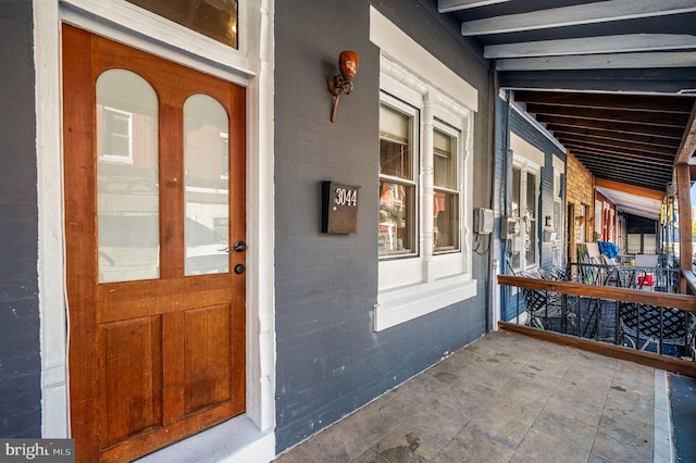 entrance to property with covered porch