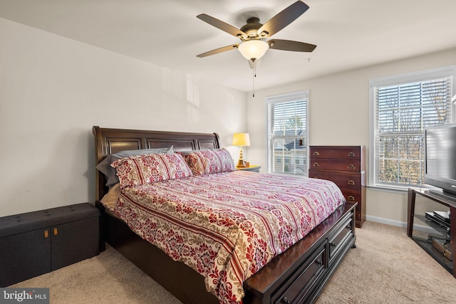 carpeted bedroom with ceiling fan