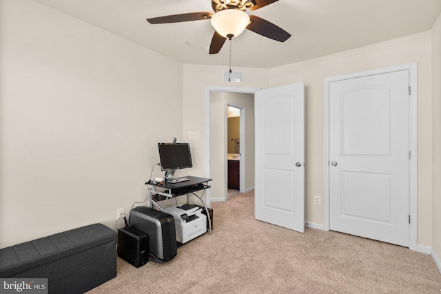 miscellaneous room featuring ceiling fan and light carpet