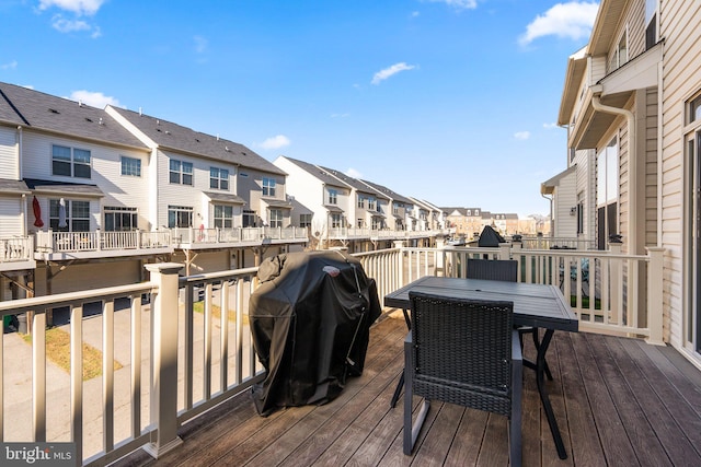 wooden terrace featuring grilling area