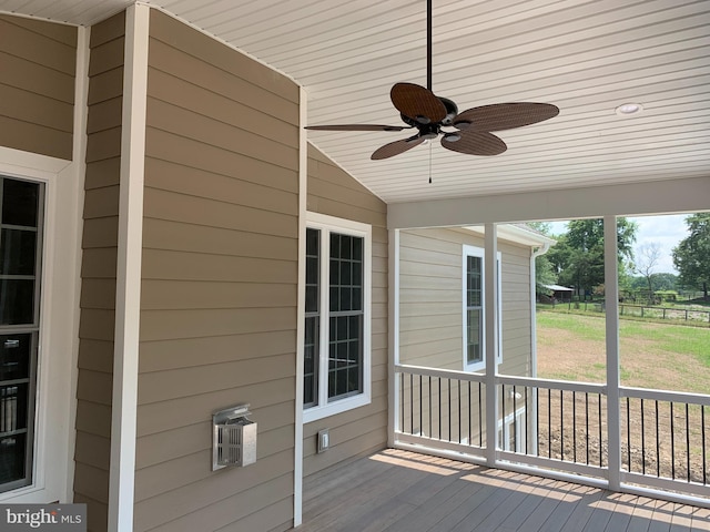 unfurnished sunroom with ceiling fan, wood ceiling, and lofted ceiling