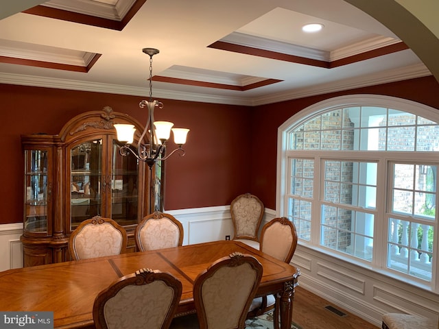 dining room featuring a healthy amount of sunlight and ornamental molding