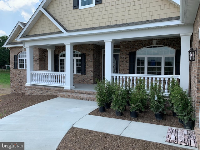 entrance to property with covered porch