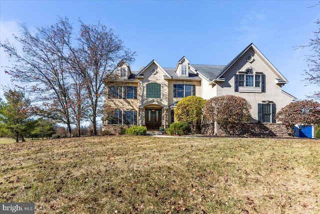 view of front of home with a front lawn